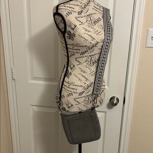 Stylish Gray Crossbody Bag with Patterned Strap